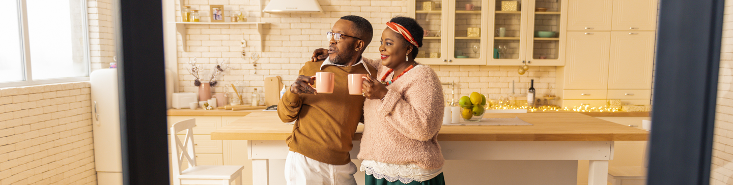 couple holding coffee mugs